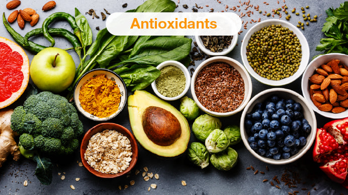 Natural ingredients and fruits in avocado cups with broccoli and apple, with text antioxidants